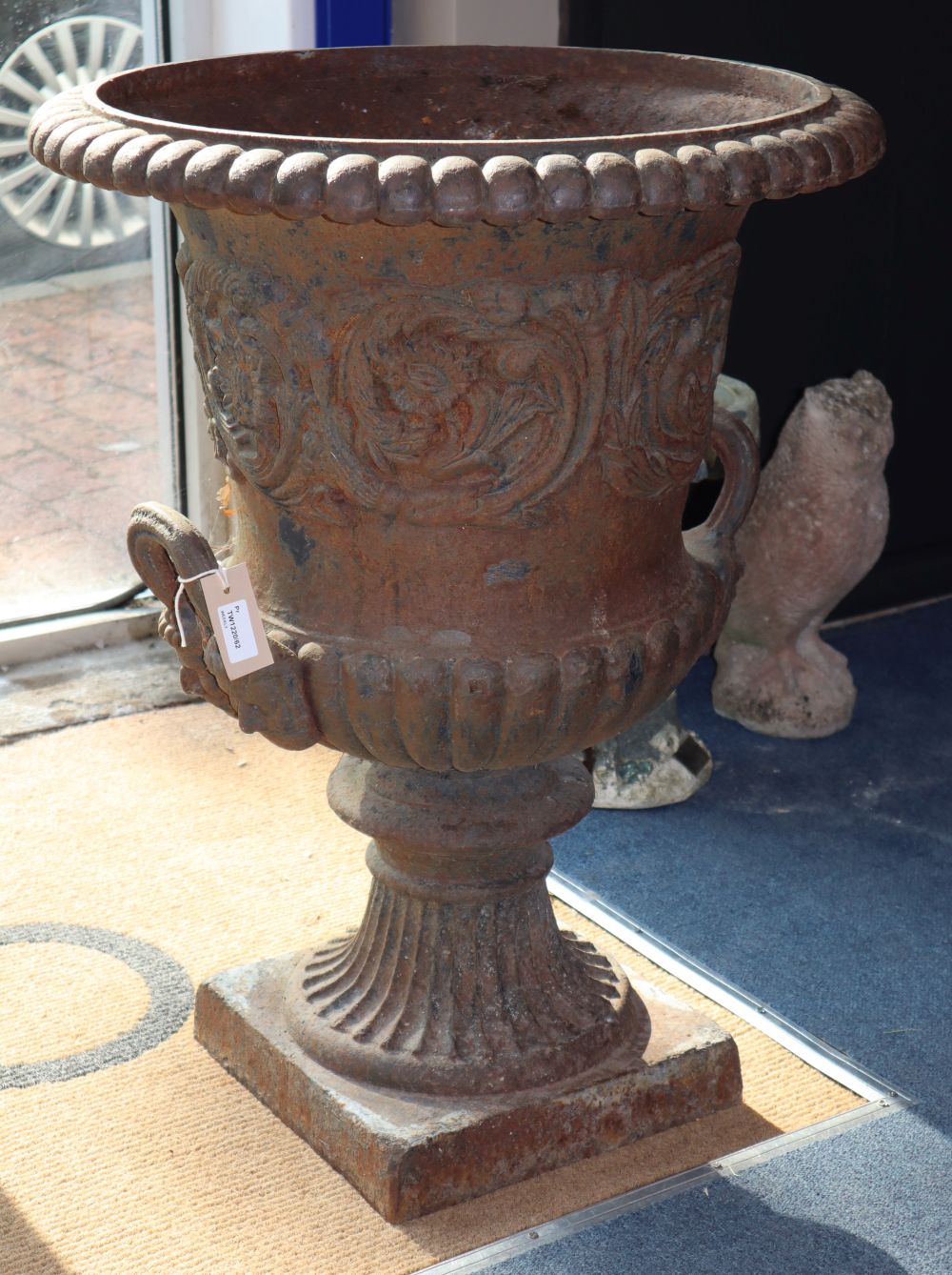 A pair of Victorian cast iron campana-shaped urns, H.74cm, diameter 56cm